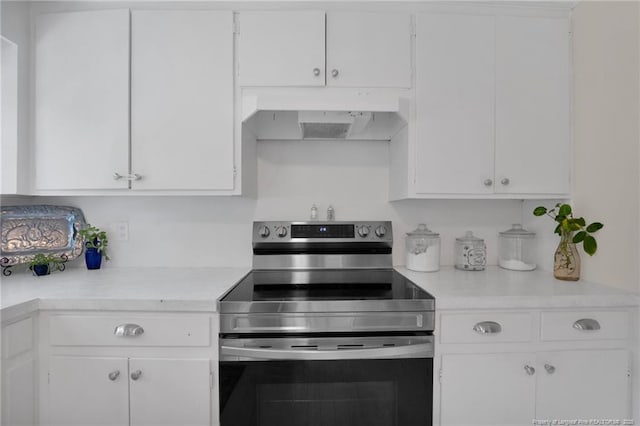 92 Nathan Dudley Rd, Clinton, NC 28328 - kitchen featuring electric range, custom range hood, light countertops, and white cabinets