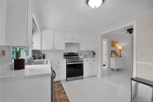 92 Nathan Dudley Rd, Clinton, NC 28328 - kitchen with electric range, under cabinet range hood, white cabinetry, light countertops, and a ceiling fan