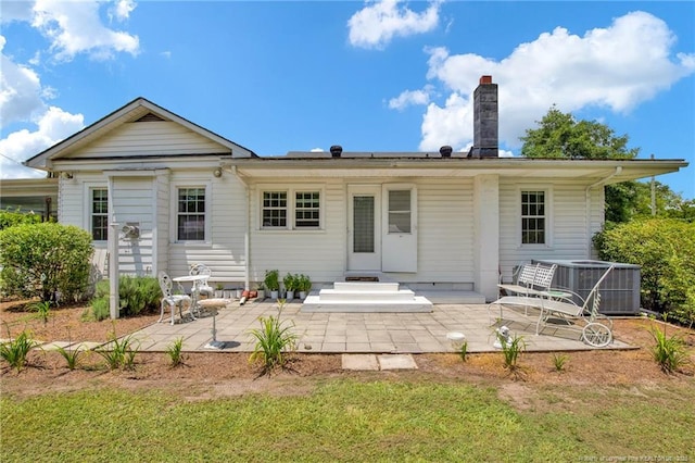 92 Nathan Dudley Rd, Clinton, NC 28328 - back of property with a patio area, a chimney, and a lawn