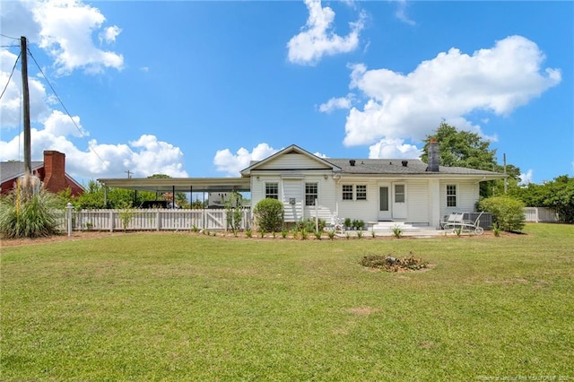 92 Nathan Dudley Rd, Clinton, NC 28328 - back of house with a patio, a chimney, and an attached carport