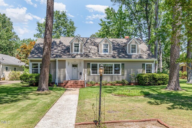 103 E Meadowbrook Dr, Smithfield, NC 27577 - cape cod home with a front yard, a shingled roof, and a chimney