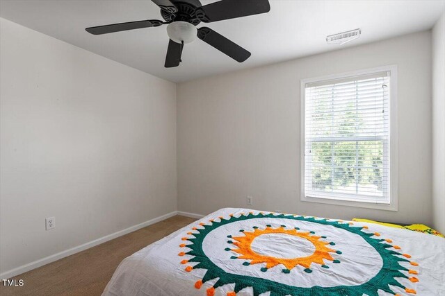 6001 Winged Willet Ct, Wendell, NC 27591 - bedroom featuring multiple windows, carpet, and a ceiling fan