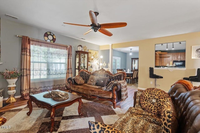 6001 Winged Willet Ct, Wendell, NC 27591 - living area with wood finished floors and ceiling fan