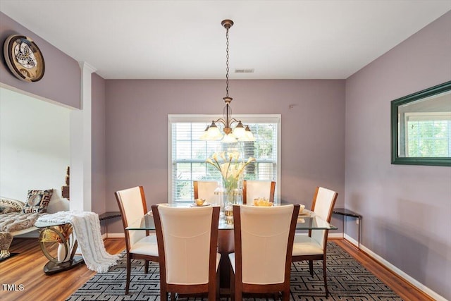 6001 Winged Willet Ct, Wendell, NC 27591 - dining space with a chandelier and wood finished floors