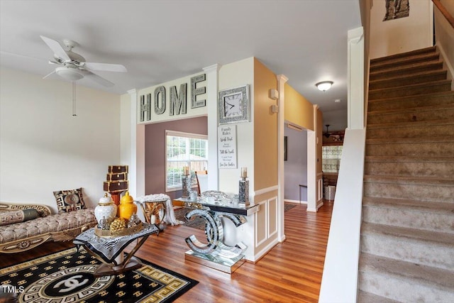 6001 Winged Willet Ct, Wendell, NC 27591 - living area with wood finished floors, stairway, and ceiling fan