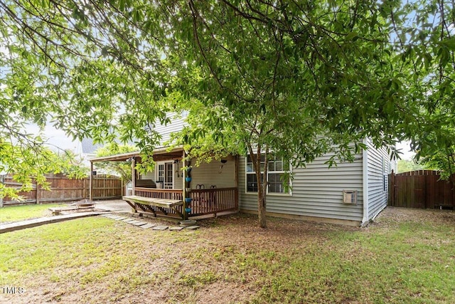6001 Winged Willet Ct, Wendell, NC 27591 - back of house with a fenced backyard and a wooden deck