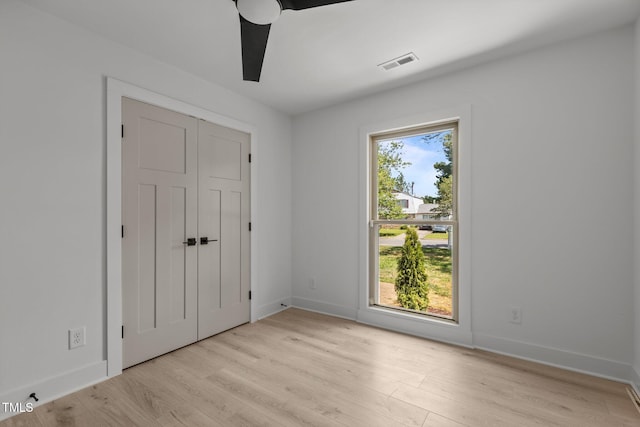 620 Red Carriage Ave, Durham, NC 27704 - unfurnished bedroom with light wood-type flooring and baseboards