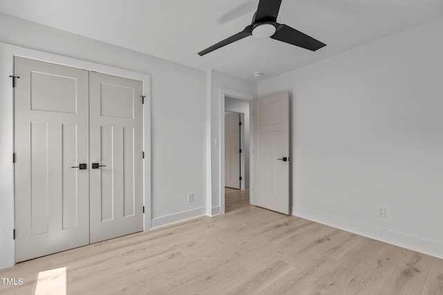 620 Red Carriage Ave, Durham, NC 27704 - unfurnished bedroom with wood finished floors, a closet, and a ceiling fan