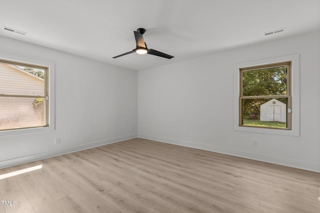 620 Red Carriage Ave, Durham, NC 27704 - empty room with light wood finished floors and a ceiling fan