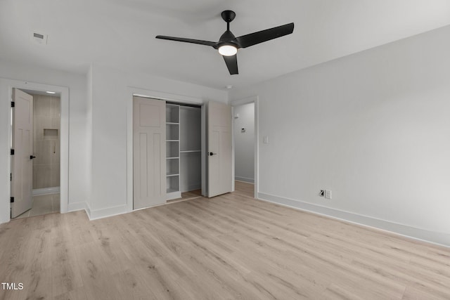 620 Red Carriage Ave, Durham, NC 27704 - unfurnished bedroom with light wood-type flooring, a closet, connected bathroom, and a ceiling fan
