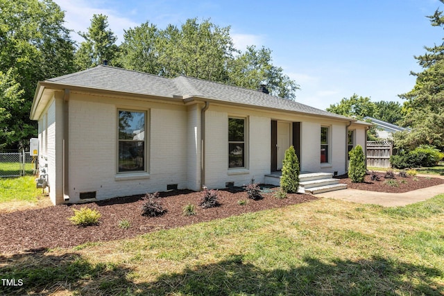 620 Red Carriage Ave, Durham, NC 27704 - view of front facade featuring brick siding, roof with shingles, and crawl space