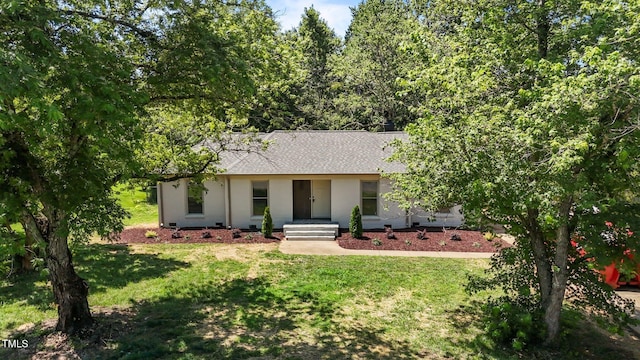620 Red Carriage Ave, Durham, NC 27704 - ranch-style house featuring roof with shingles, a front yard, and stucco siding