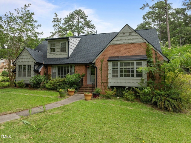 3516 Swift Dr, Raleigh, NC 27606 - english style home with a shingled roof, brick siding, and a front lawn