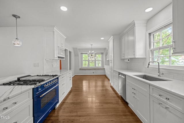 3516 Swift Dr, Raleigh, NC 27606 - kitchen featuring gas stove, a chandelier, healthy amount of natural light, dishwasher, and recessed lighting