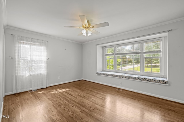 3516 Swift Dr, Raleigh, NC 27606 - unfurnished room featuring crown molding, wood finished floors, and a ceiling fan