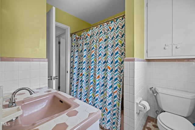 3516 Swift Dr, Raleigh, NC 27606 - bathroom featuring tile walls, a shower with shower curtain, and wainscoting