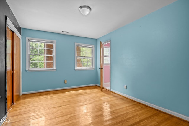 3516 Swift Dr, Raleigh, NC 27606 - unfurnished bedroom with light wood finished floors and a closet