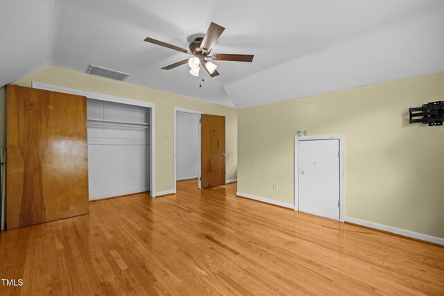 3516 Swift Dr, Raleigh, NC 27606 - unfurnished bedroom featuring lofted ceiling, light wood-style flooring, and ceiling fan