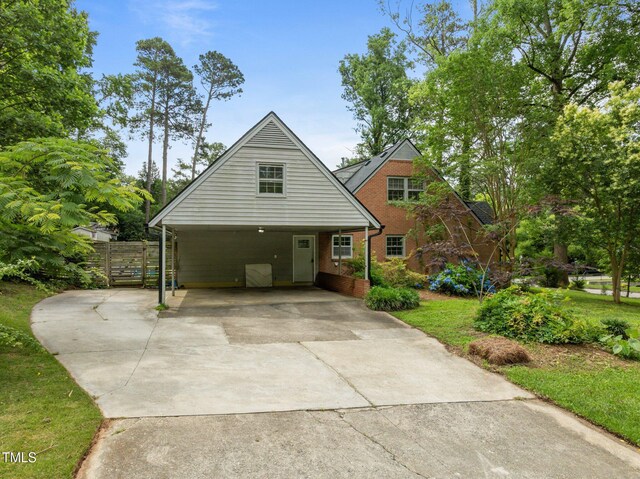 3516 Swift Dr, Raleigh, NC 27606 - view of front of property with concrete driveway, brick siding, and a carport