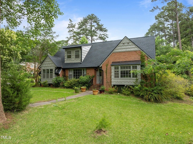 3516 Swift Dr, Raleigh, NC 27606 - view of front facade featuring brick siding, a shingled roof, and a front lawn