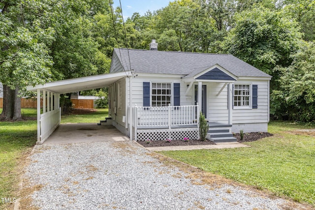 603 S Third St, Mebane, NC 27302 - bungalow-style house featuring driveway, roof with shingles, an attached carport, and a front yard