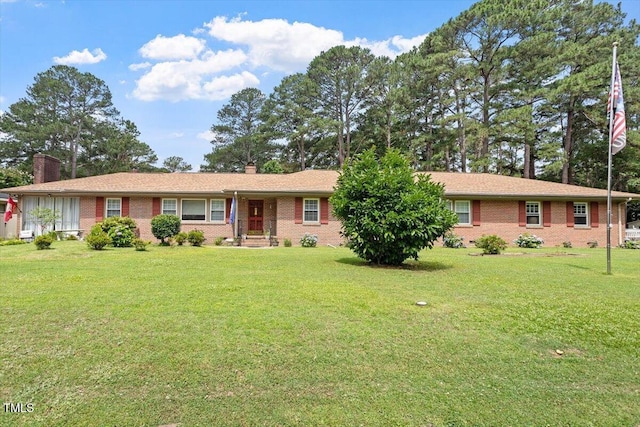 1103 Treemont Rd NW, Wilson, NC 27896 - single story home featuring a chimney and brick siding