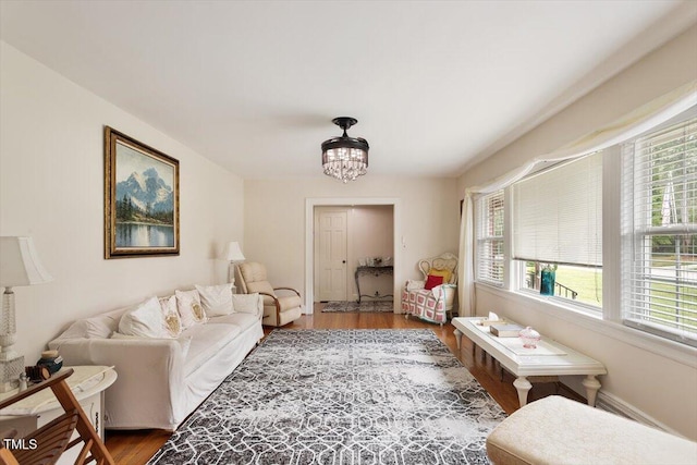 1103 Treemont Rd NW, Wilson, NC 27896 - living area with wood finished floors and a chandelier