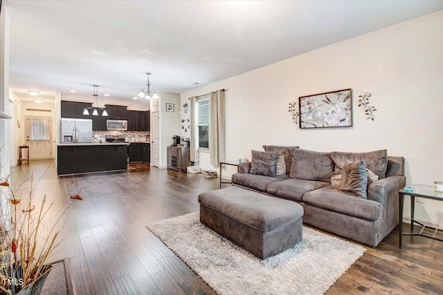 51 Balboa Pkwy, Clayton, NC 27520 - living area featuring a chandelier and dark wood-style floors