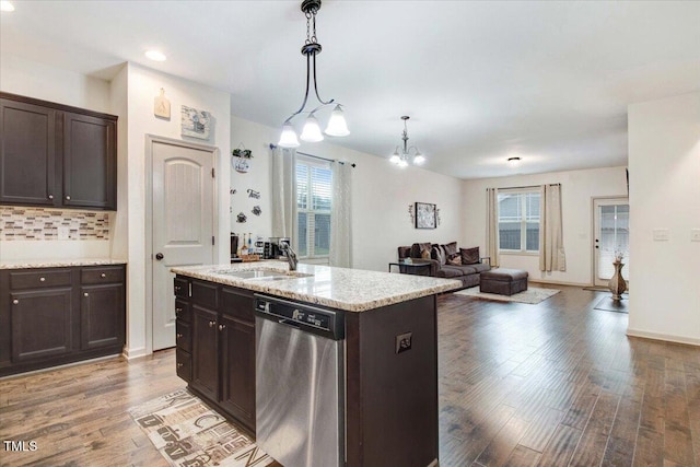 51 Balboa Pkwy, Clayton, NC 27520 - kitchen with stainless steel dishwasher, dark brown cabinets, wood finished floors, and recessed lighting