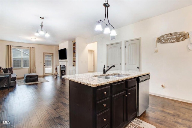 51 Balboa Pkwy, Clayton, NC 27520 - kitchen with a chandelier, dishwasher, open floor plan, pendant lighting, and a fireplace