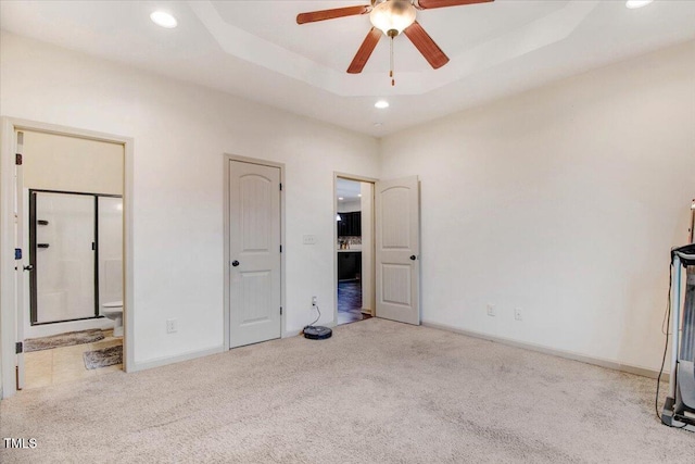 51 Balboa Pkwy, Clayton, NC 27520 - unfurnished bedroom featuring carpet flooring, recessed lighting, ensuite bath, and a tray ceiling
