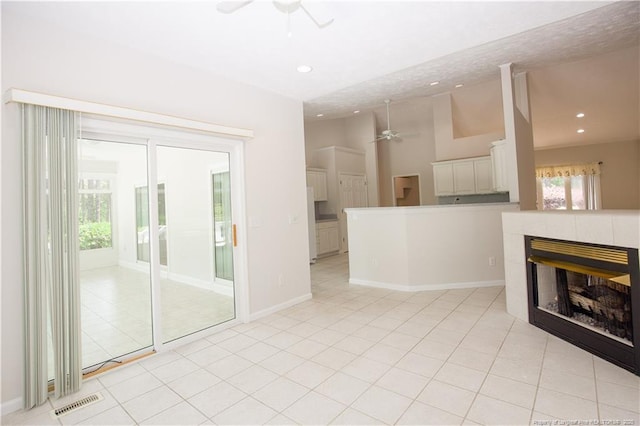 38 Windsong Pl, Whispering Pines, NC 28327 - unfurnished living room featuring ceiling fan, a tile fireplace, recessed lighting, and light tile patterned floors