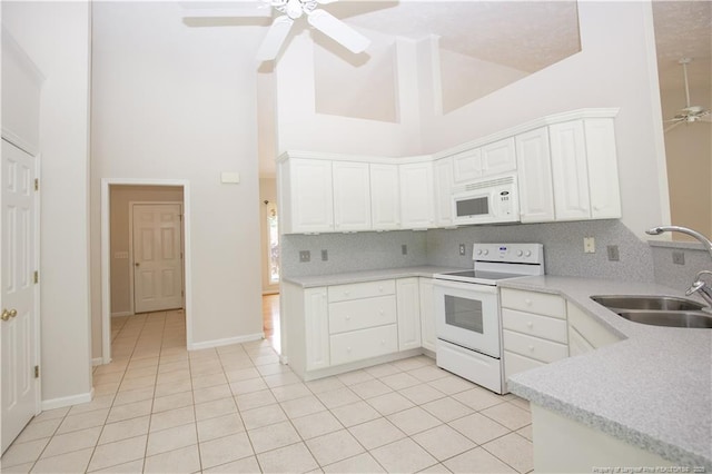 38 Windsong Pl, Whispering Pines, NC 28327 - kitchen with white appliances, high vaulted ceiling, a ceiling fan, light tile patterned floors, and decorative backsplash