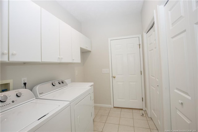 38 Windsong Pl, Whispering Pines, NC 28327 - laundry room featuring cabinet space, separate washer and dryer, and light tile patterned floors