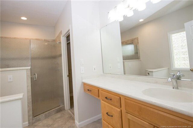 38 Windsong Pl, Whispering Pines, NC 28327 - full bathroom featuring tile patterned flooring, a shower stall, vanity, and recessed lighting