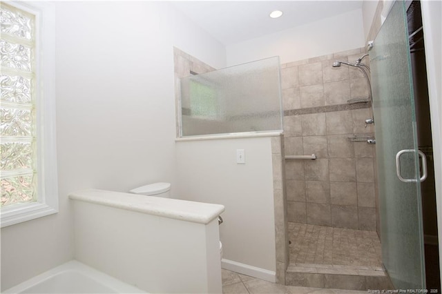 38 Windsong Pl, Whispering Pines, NC 28327 - bathroom with tiled shower, a garden tub, recessed lighting, and tile patterned floors