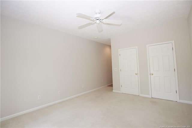 38 Windsong Pl, Whispering Pines, NC 28327 - unfurnished bedroom with light colored carpet and a ceiling fan