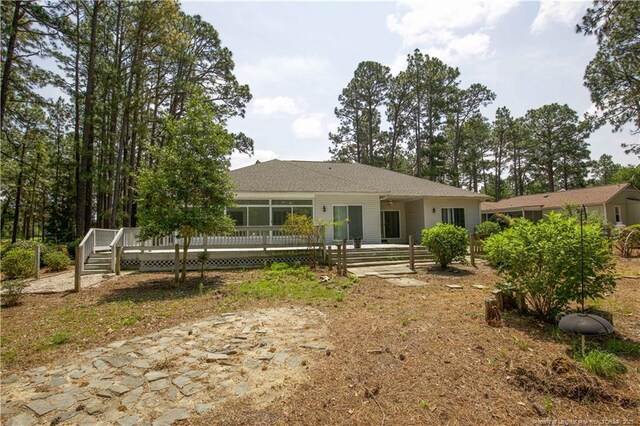38 Windsong Pl, Whispering Pines, NC 28327 - view of front of house with a wooden deck
