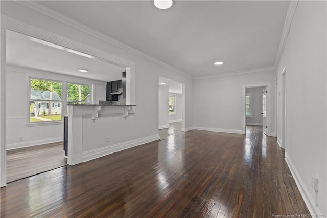 123 John St, Fayetteville, NC 28305 - unfurnished living room with plenty of natural light, dark wood finished floors, and crown molding