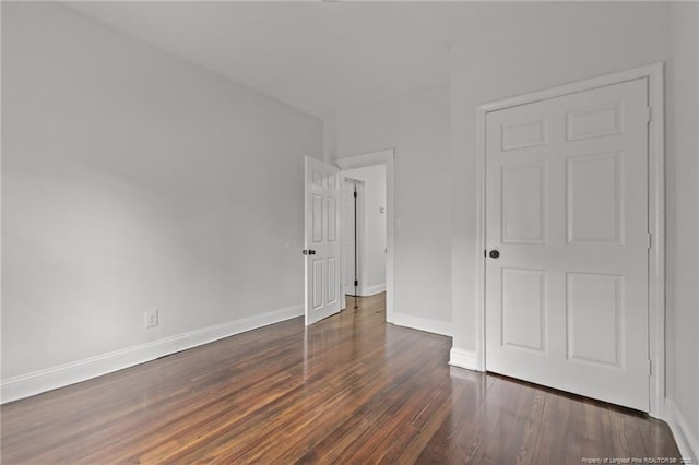 123 John St, Fayetteville, NC 28305 - unfurnished bedroom with wood finished floors and baseboards