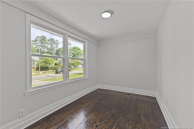 123 John St, Fayetteville, NC 28305 - empty room with dark wood-style floors and ornamental molding