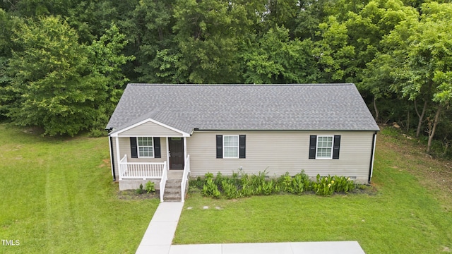 427 Elm Ct, Burlington, NC 27217 - view of front of house with covered porch, roof with shingles, and a front lawn