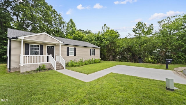 427 Elm Ct, Burlington, NC 27217 - view of front of home featuring covered porch, a front lawn, and a shingled roof