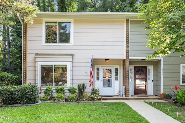 6021 Dixon Dr, Raleigh, NC 27609 - view of front facade with a front yard