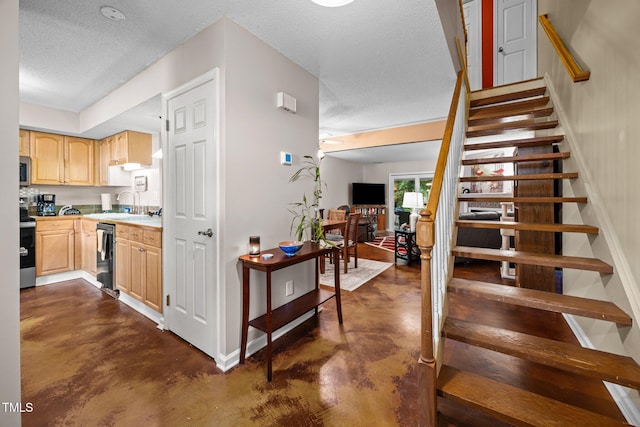 6021 Dixon Dr, Raleigh, NC 27609 - stairway with finished concrete floors and a textured ceiling