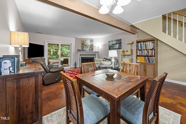 6021 Dixon Dr, Raleigh, NC 27609 - dining room with concrete floors, a fireplace, and stairs