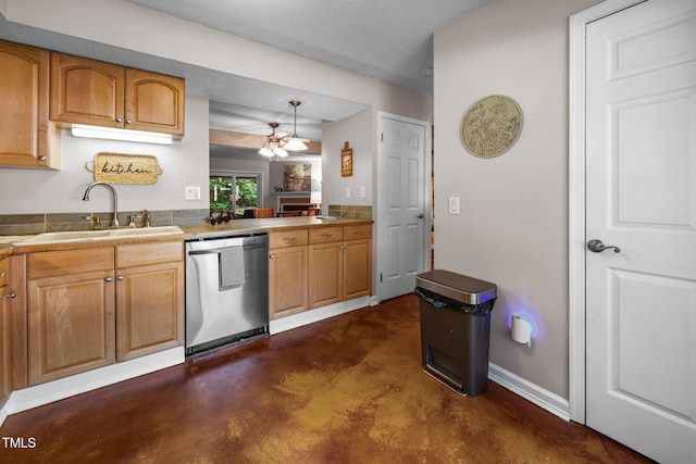 6021 Dixon Dr, Raleigh, NC 27609 - kitchen with stainless steel dishwasher, concrete flooring, a ceiling fan, a fireplace, and decorative light fixtures