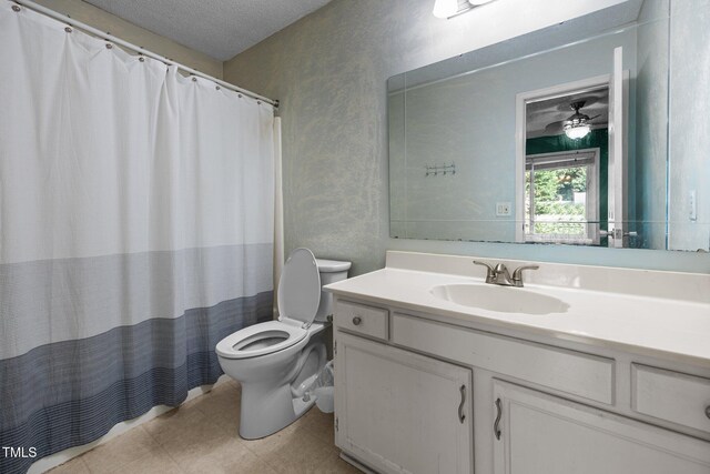 6021 Dixon Dr, Raleigh, NC 27609 - full bathroom featuring vanity, a textured ceiling, a shower with shower curtain, and a textured wall