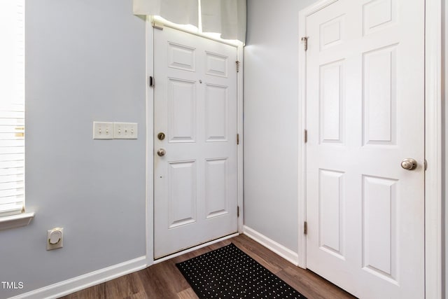 320 Gilman Ln Unit 106, Raleigh, NC 27610 - doorway to outside with baseboards and dark wood finished floors