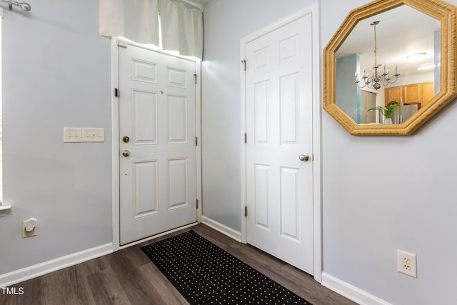 320 Gilman Ln Unit 106, Raleigh, NC 27610 - entrance foyer with a chandelier and dark wood-type flooring